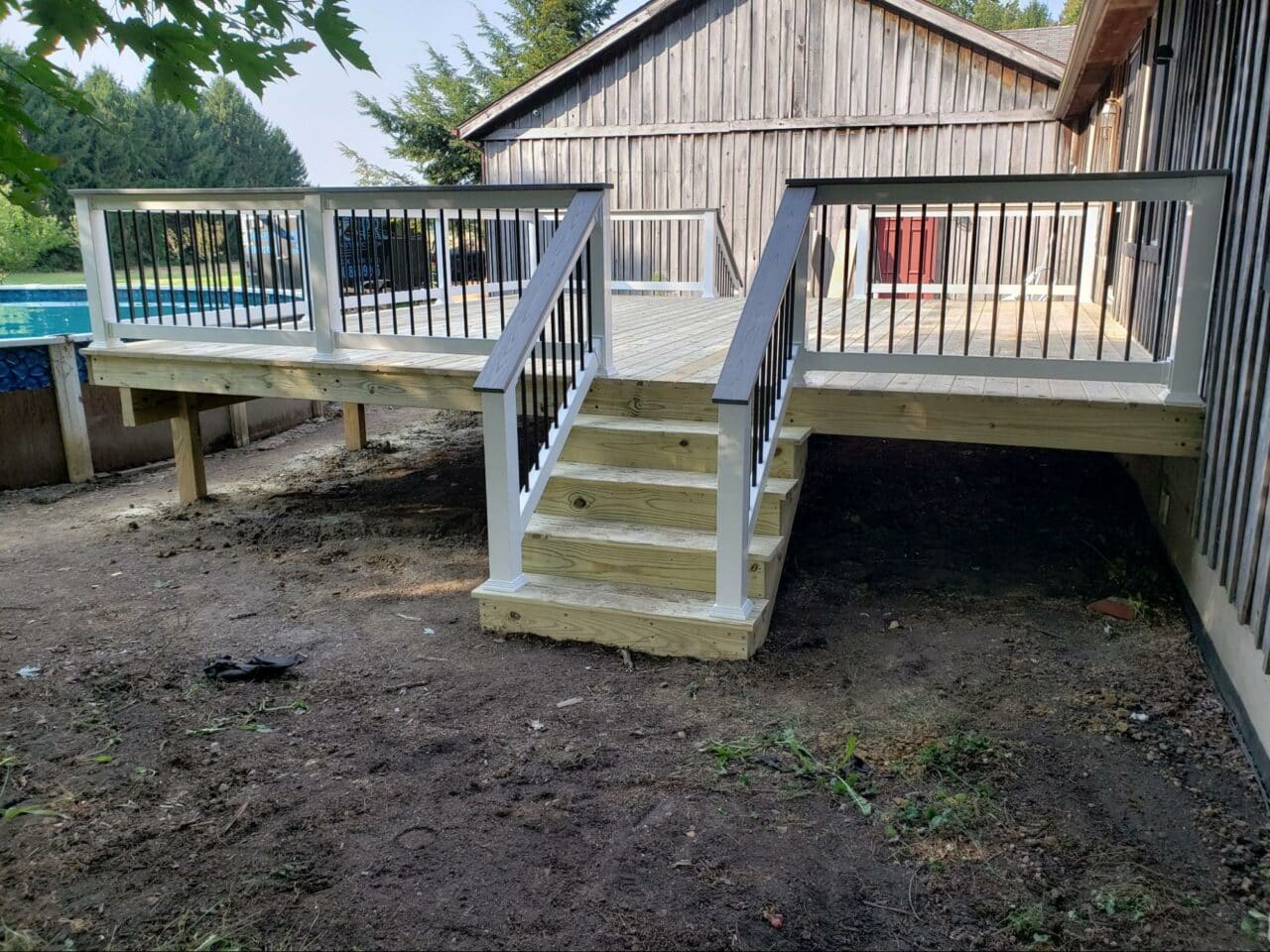 Photo of a traditional wood deck with steps.