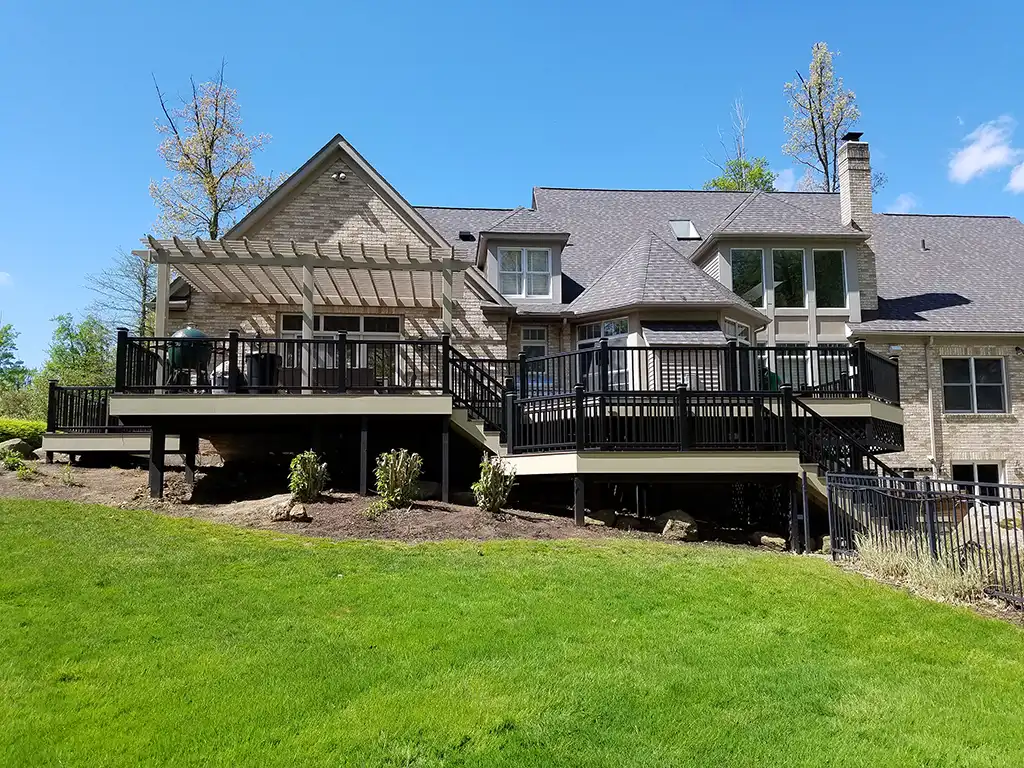 Photo of a home with a multi-level deck spanning a sloped yard